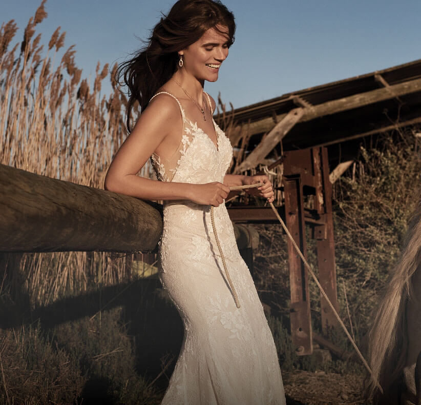 Model wearing a white Bohemian Style Gown