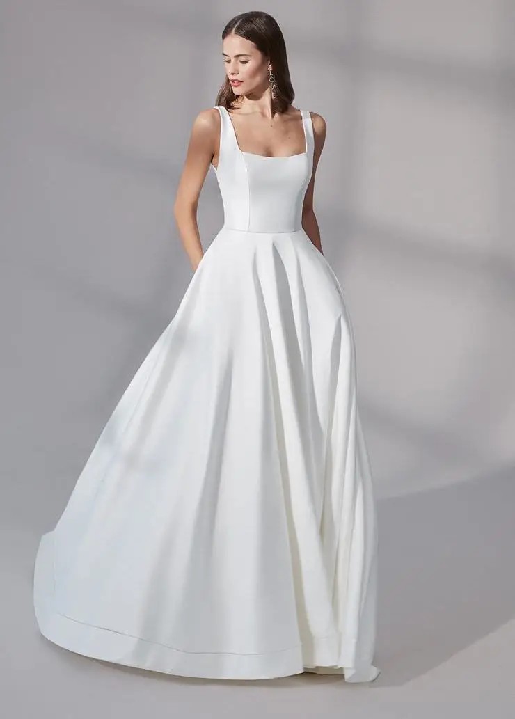 Model wearing a white Ballgown Style Gown