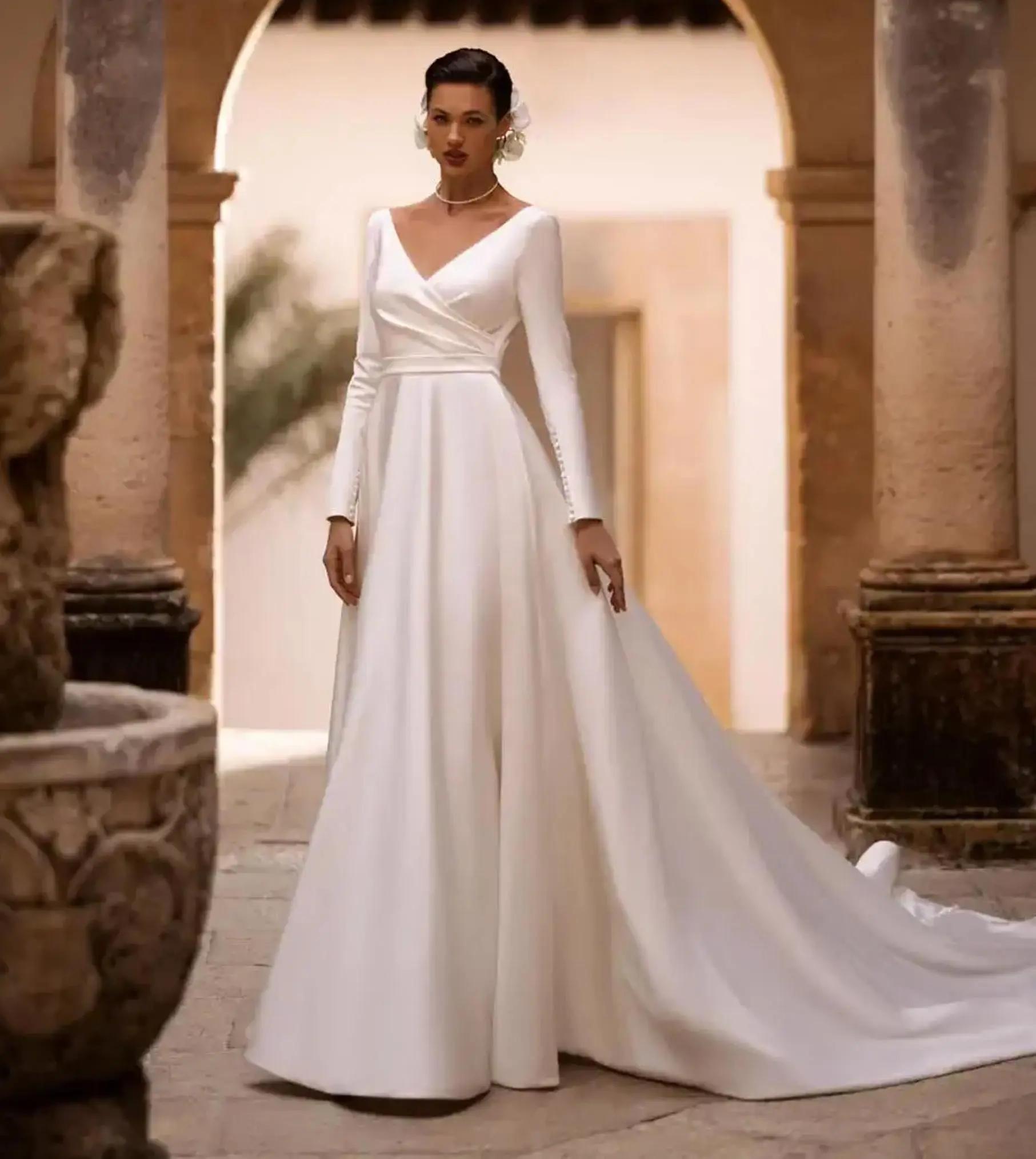 Model wearing a white Classic Style Gown
